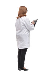 qualified female doctor writing a prescription for a patient