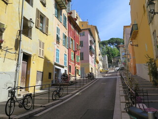 a street with the view of the Escalier Jules Eynaudi (steps Jules Eynaudi) in Nice, French Riviera,...