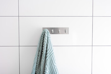 Towel on a hook in bathroom