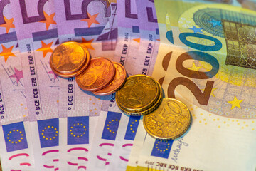 coins on the euro banknotes