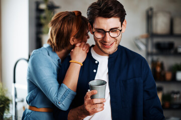 Loving couple standing in their kitchen