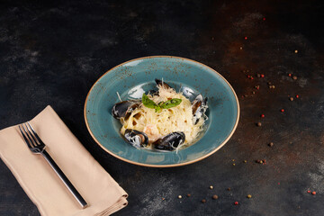 Pasta with seafood, dark background