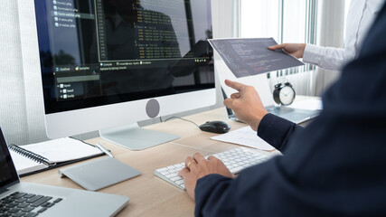 Asian Software engineer Programmer team working together on project of the System Coding New...