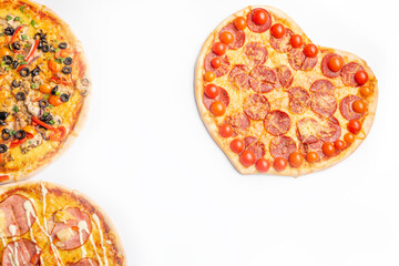 three different kinds of pizzas