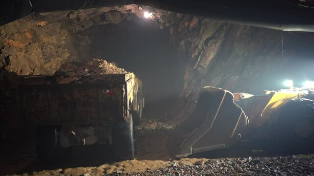 The underground loader stops working. The driver gets out of the forklift and leaves.