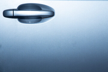 Silver background of modern car door with handle, silver texture
