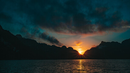 Landscape of lake with mountain and sunrise