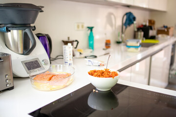dishes of fish for cooking in a white kitchen for lunch