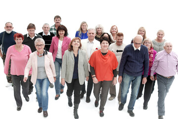 Fototapeta premium Casual group of people walking isolated over a white background