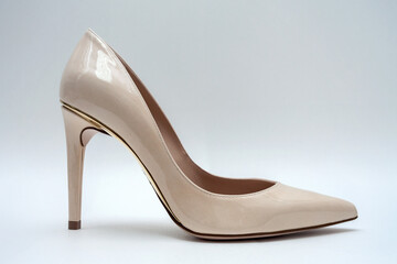 Fashion high heels women shoes beige color. Stiletto shoe style in ladies wardrobe. High fashion...