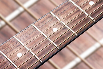 Guitar fret isolated. Music background. Wooden guitar part close up. Guitar strings background.