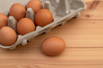 eggs in a package on a wooden table, ingredients