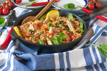 Healthy mediterranean  fish dinner with rice in a skillet