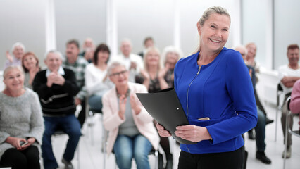 Businesswoman addressing colleagues at office meeting