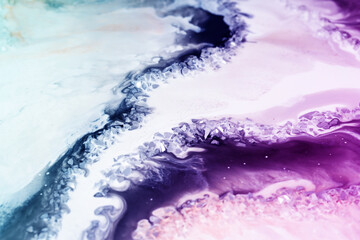 Fluid Art. Abstract colorful background, wallpaper, texture in purple blue tones colors. Mixing paints. Modern art. Marble texture.