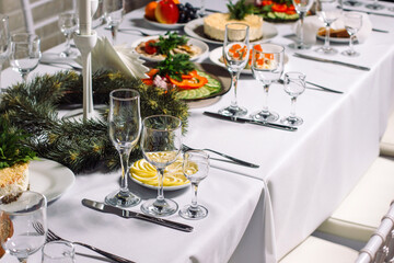 Festive wedding table set for dinner, beautiful expensive dishes.