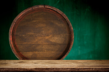 Old wooden barrel on a brown background