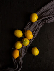 Fototapeta na wymiar Lemons on dark background. Food photography. still life photography. Fresh fruit. Nature.