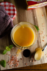 Homemade salted caramel in jam jar, butter cream sauce