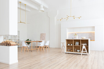 interior design spacious bright studio apartment in Scandinavian style and warm pastel white and beige colors. trendy furniture in the living area and modern details in the kitchen area.