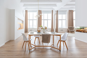 interior design spacious bright studio apartment in Scandinavian style and warm pastel white and beige colors. trendy furniture in the living area and modern details in the kitchen area.