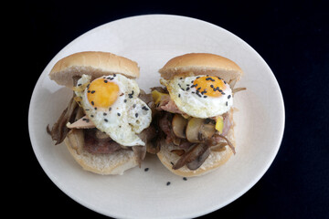 burgers with mushrooms and fried eggs