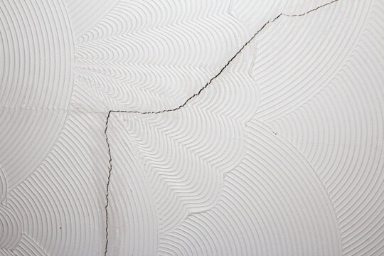 Artex ceiling cracking and breaking on the plaster board joins. Artex surface coating was a popular decorating choice during the 1970's and has since fallen out of favour in home renovations.