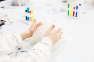 boy study science education. Chemical laboratory with test tubes for experiments and multi-colored liquids