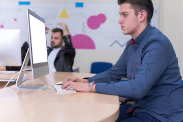 Group of muttiethnic IT students working at their computer lab.  Group of student listening lesson from their professor. Education and technology concept.