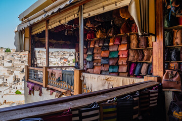 Balcony of a leather goods shop, with bags on display and a view over the tanneries.
Fès, Morocco.