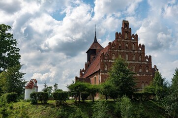 Fototapeta na wymiar Filial church of St. John the Baptist in Tłokowo, Warmia, Gothic brick church, from south-east