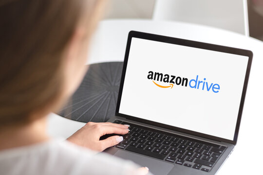 Guilherand-Granges, France - February 16, 2021. Notebook with Amazon Drive app logo.  Cloud storage application managed by Amazon. Secure cloud storage, file backup and file sharing.