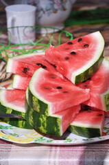 Pieces of ripePieces of ripe watermelon on the table with teapot and cup watermelon on the table with teapot