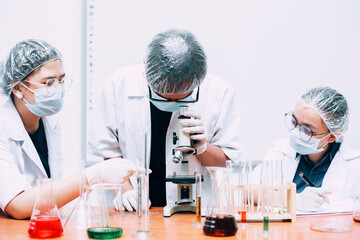 Scientist researcher using microscope in laboratory. Medical healthcare technology and pharmaceutical research and development