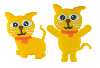 Happy smile plasticine yellow cat in sit and stand action on white