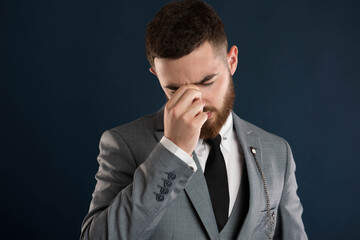 Handsome young businessman having a bad day