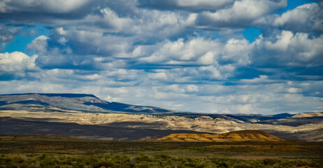 Fototapeta na wymiar Rain clouds during the day over the plains in Utah, US