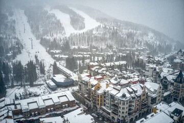 Aerial View of World Famous Vail, Colorado during an unexpected snowstorm - obrazy, fototapety, plakaty