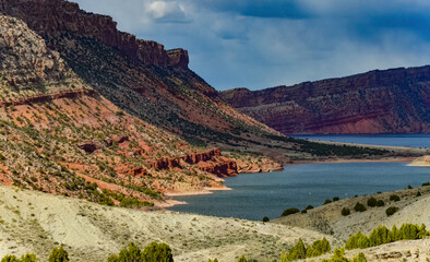 Mountainous landscape, a lake among the red mountains, islands in the lake. Utah, US