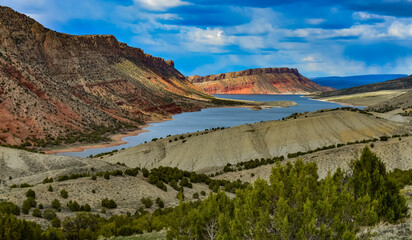 Mountainous landscape, a lake among the red mountains, islands in the lake. Utah, US