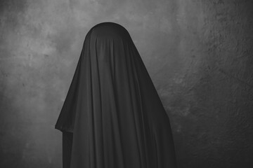 woman wearing hijab black cloth isolated background