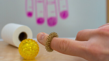Sujok korean medicine methods. Using special ring instrument for acupuncture treatment. Closeup...