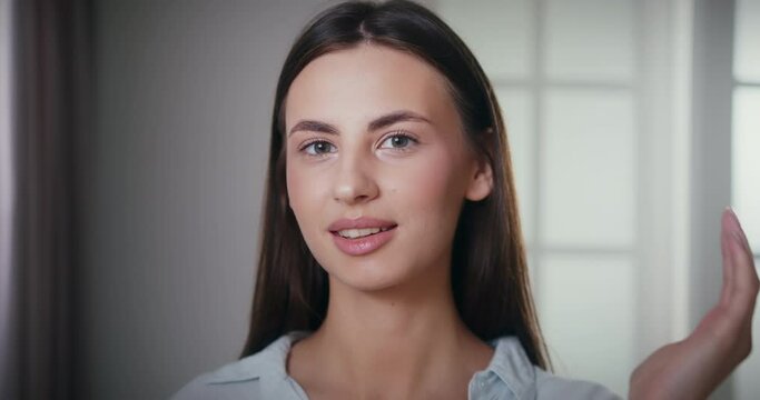 Beauty portrait of sophisticated young woman with delicate smooth skin and idel complexion. Beautiful lady covering face with hands. Body and skincare concept.