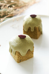 Green Tea Cube pound cake set on cafe table.