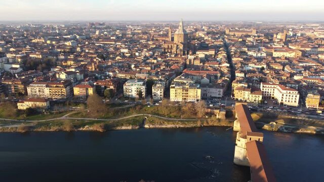 Drone view of the medieval city of Pavia in Italy : flyng over Ticino river and Old Town