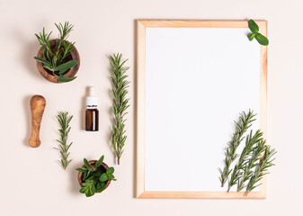 top view, white sheet of paper with rosemary, essential oil and mortar
