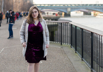 Portrait of Portuguese woman with light jacket and purple clothes