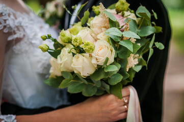 Bouquet of flowers in the hand of the bride