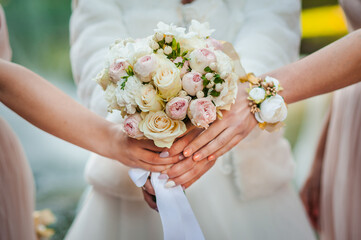 Bouquet of flowers in the hand of the bride