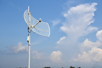 Outdoor internet wifi receiver and repeater installed on pole in long distant area of Thailand to receive signal from the wi-fi transmission tower and repeat it to the people's access points nearby.